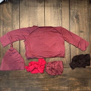 Lila baby gown, hat, and 3 colorful bow headbands.